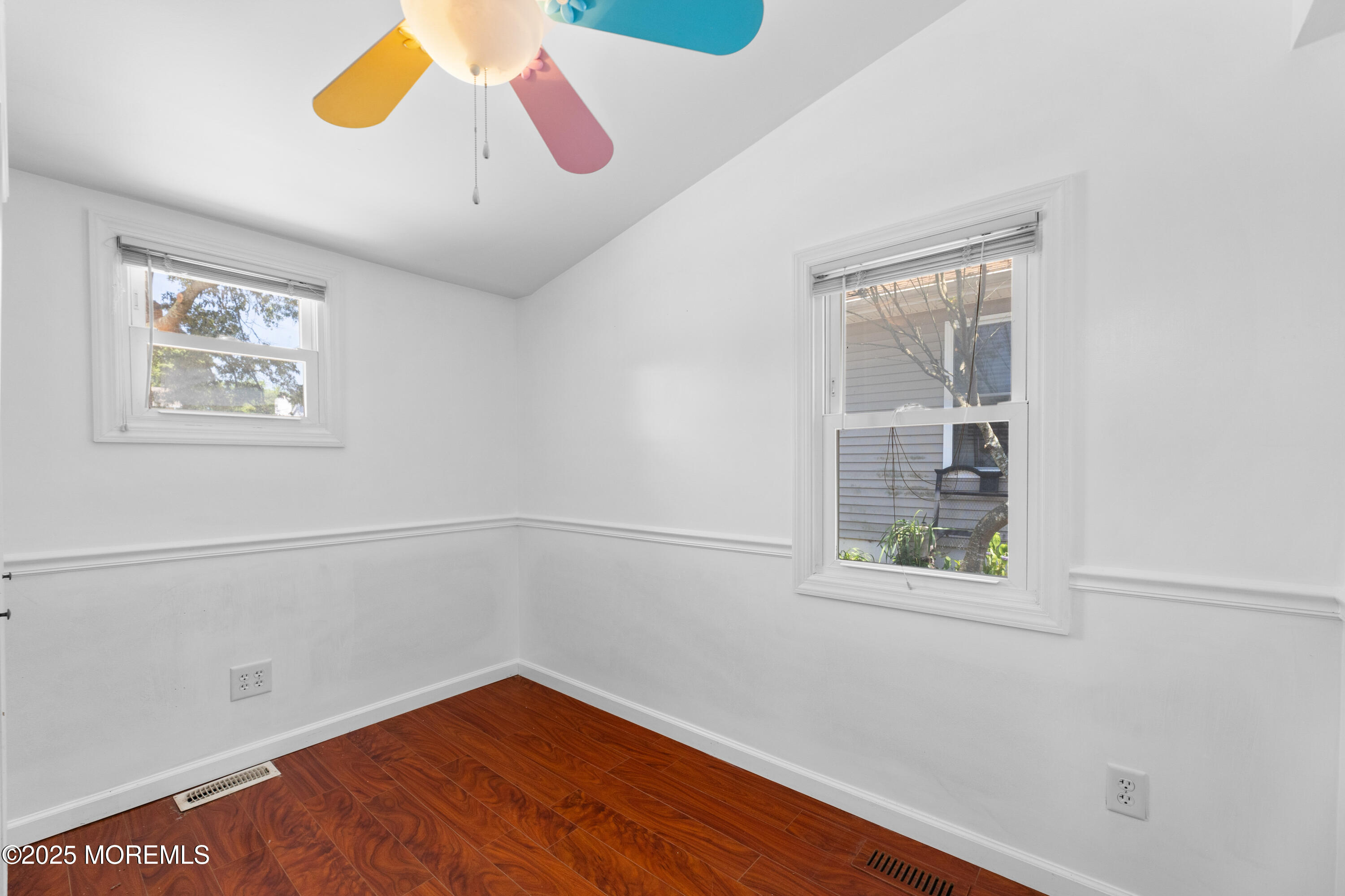 474 Burnt Bark Road Brick, NJ 08723 - Photo 17 of 28 a view of an empty room with a window and wooden floor