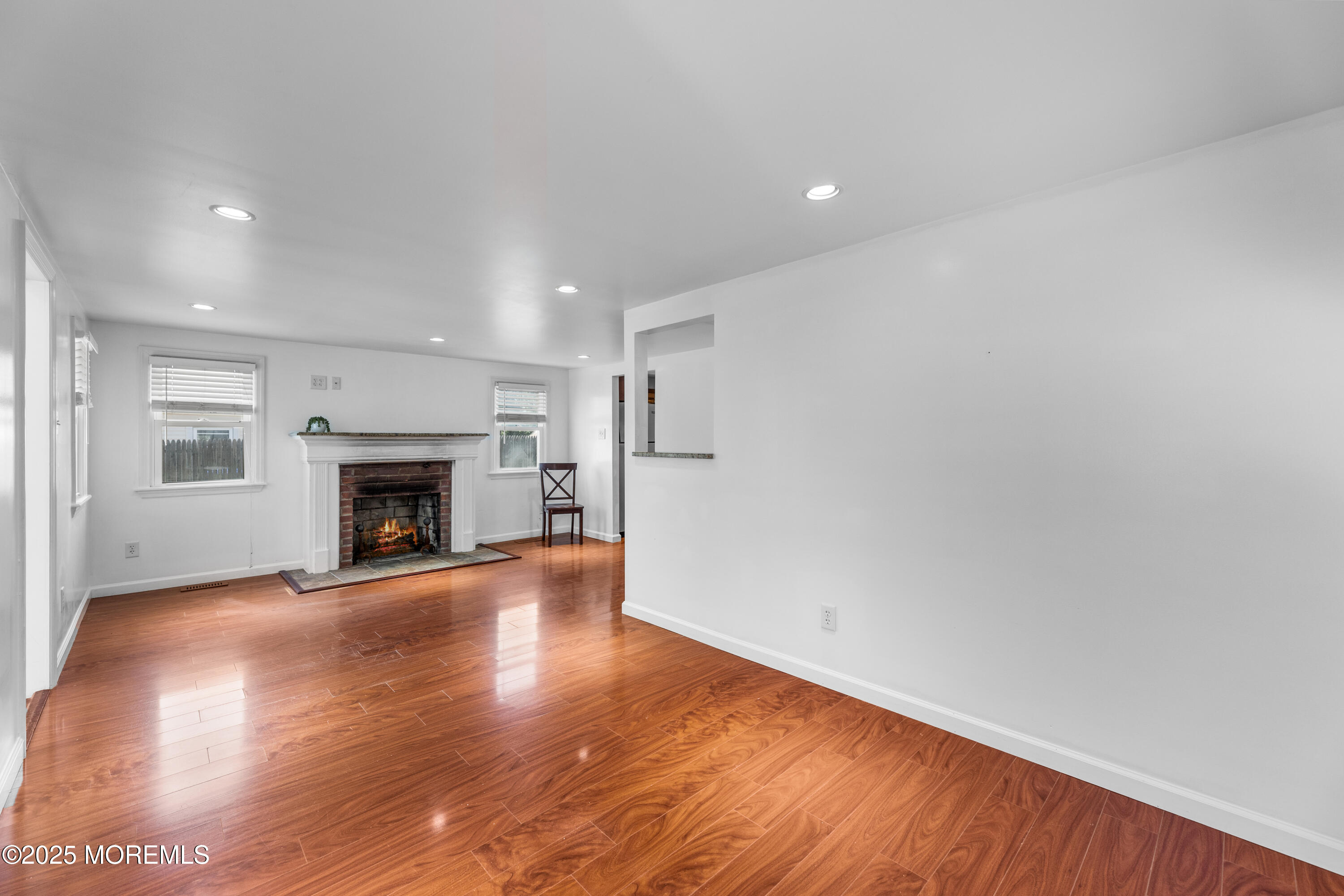 474 Burnt Bark Road Brick, NJ 08723 - Photo 9 of 28 a view of an empty room with wooden floor fireplace and a window