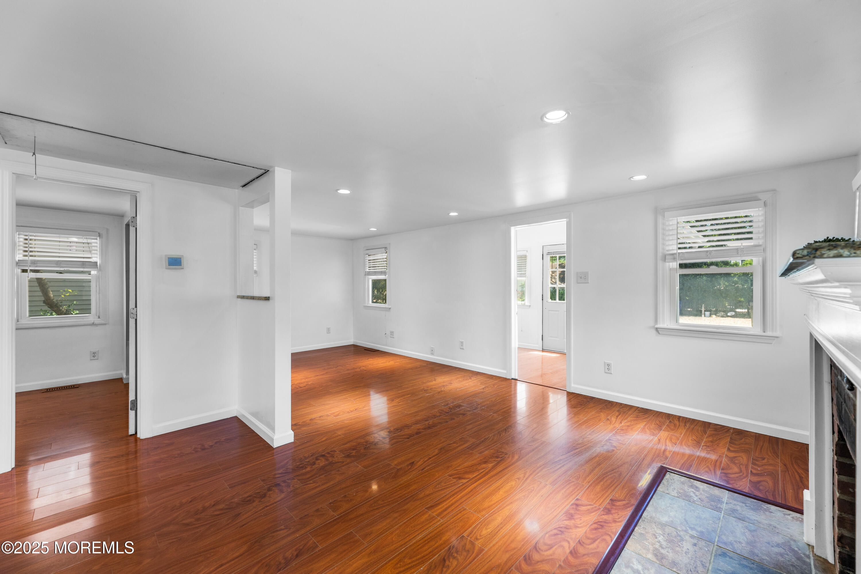 474 Burnt Bark Road Brick, NJ 08723 - Photo 10 of 28 a view of an empty room with wooden floor and a window
