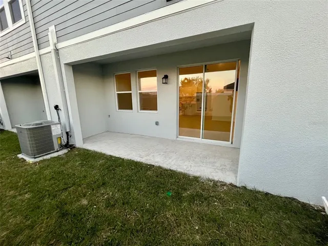 a view of backyard with large windows