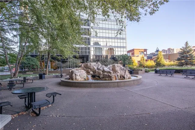 a view of a patio with table and chairs and potted plants
