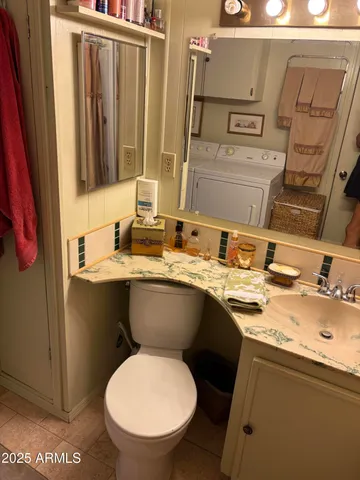 a bathroom with a toilet a sink and a shower