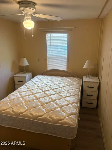 a kitchen with a sink cabinets and wooden floor