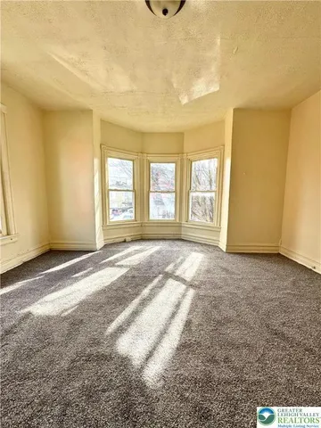 a view of a livingroom with a staircase