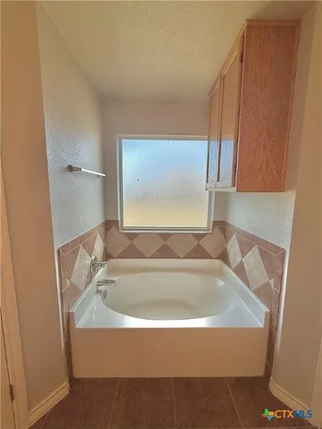 a bathroom with a bathtub