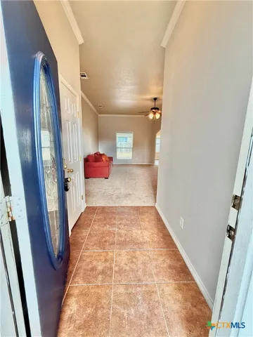 a view of a hallway view with staircase
