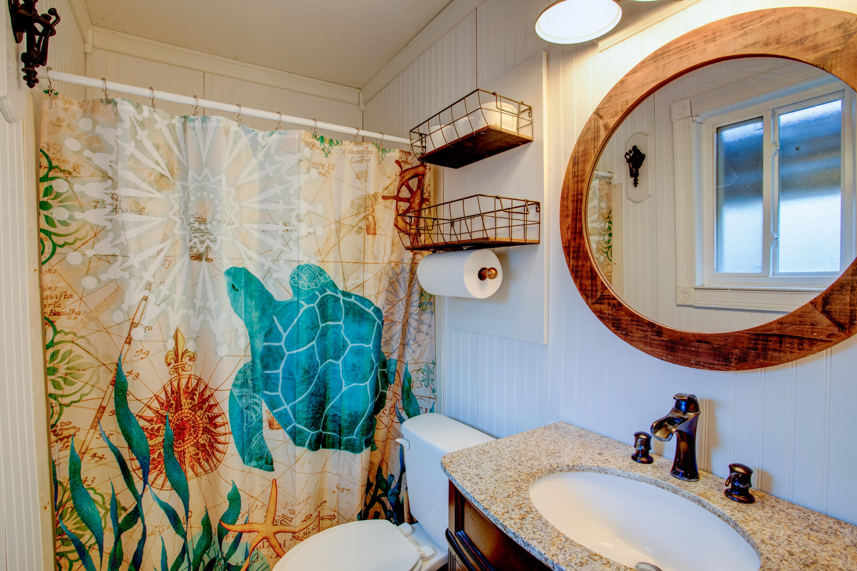 60 Linwood Road Northwest Fort Walton Beach, FL 32547 - Photo 11 of 14 a bathroom with a sink and mirror with toilet
