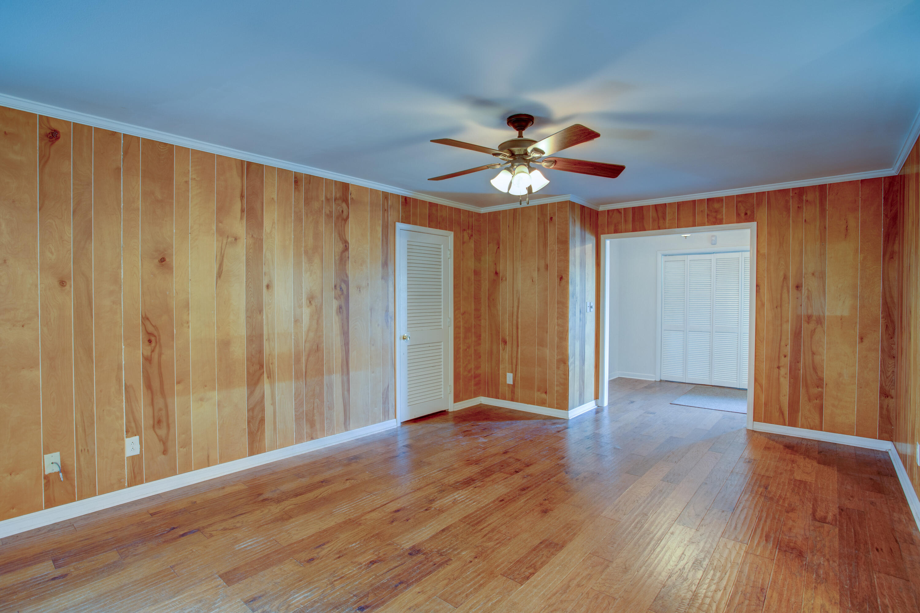 60 Linwood Road Northwest Fort Walton Beach, FL 32547 - Photo 7 of 14 a view of an empty room with a window and wooden floor