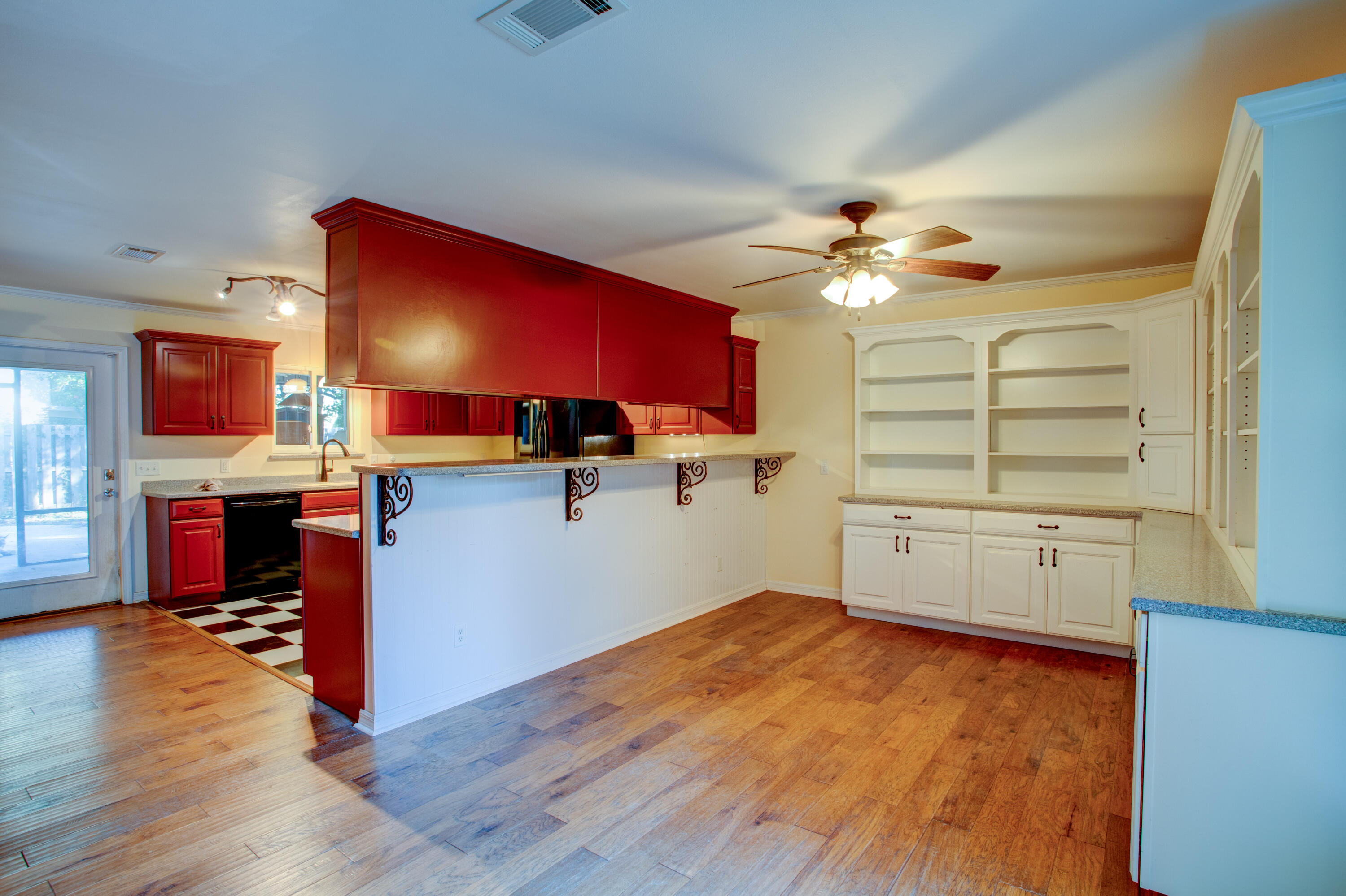 60 Linwood Road Northwest Fort Walton Beach, FL 32547 - Photo 8 of 14 a kitchen with stainless steel appliances granite countertop a stove top oven a sink with wooden floors