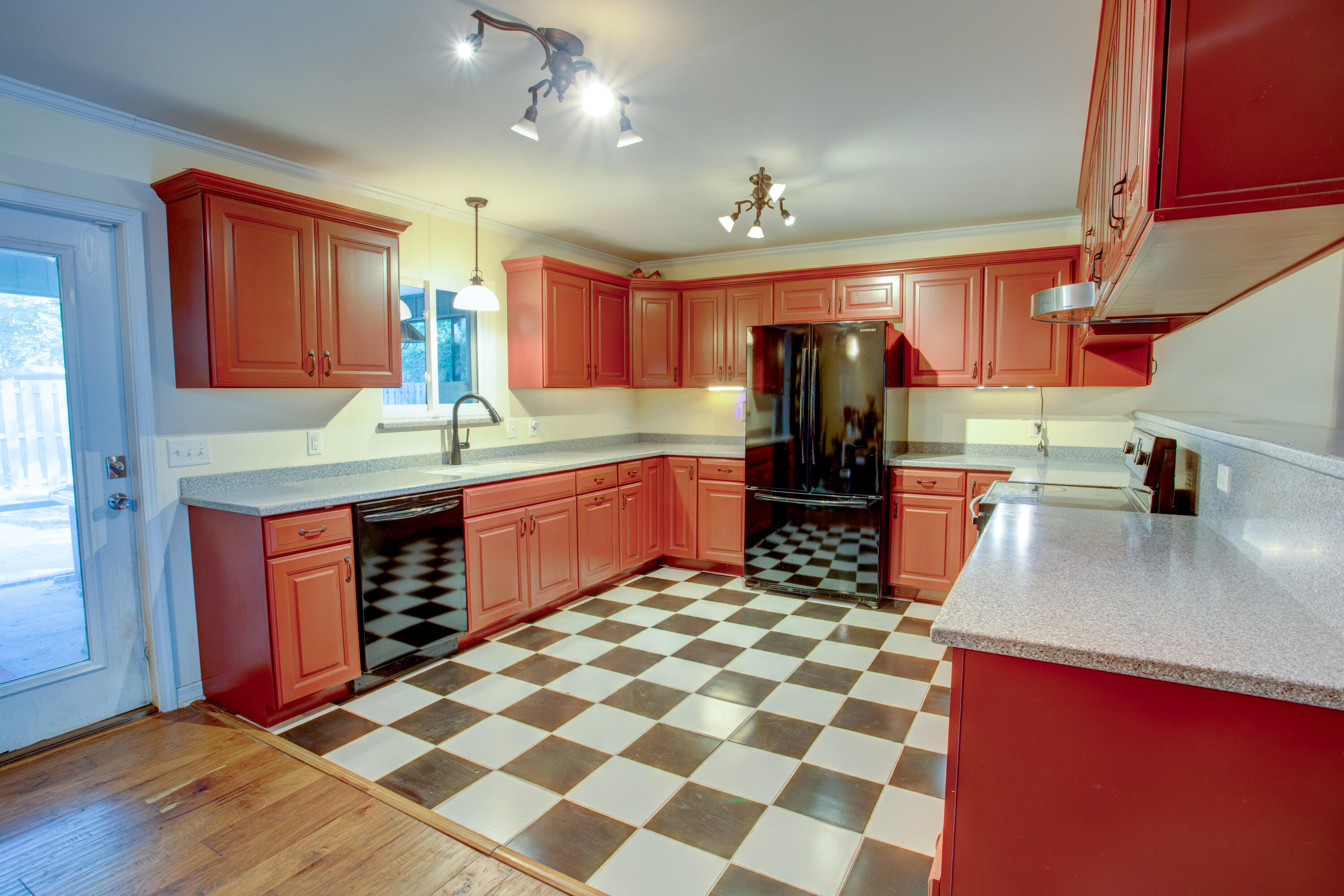 60 Linwood Road Northwest Fort Walton Beach, FL 32547 - Photo 10 of 14 a kitchen with stainless steel appliances granite countertop a sink stove and cabinets