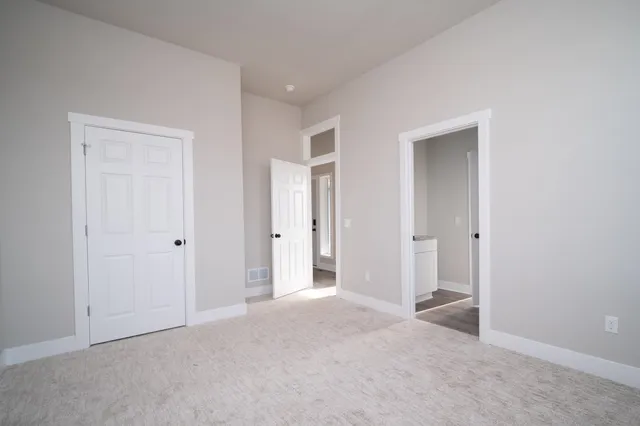 a view of a bathroom with closet area
