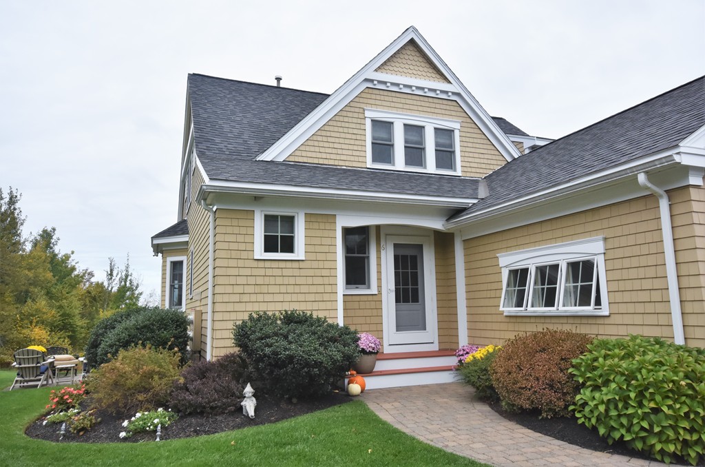 a front view of a house with a yard