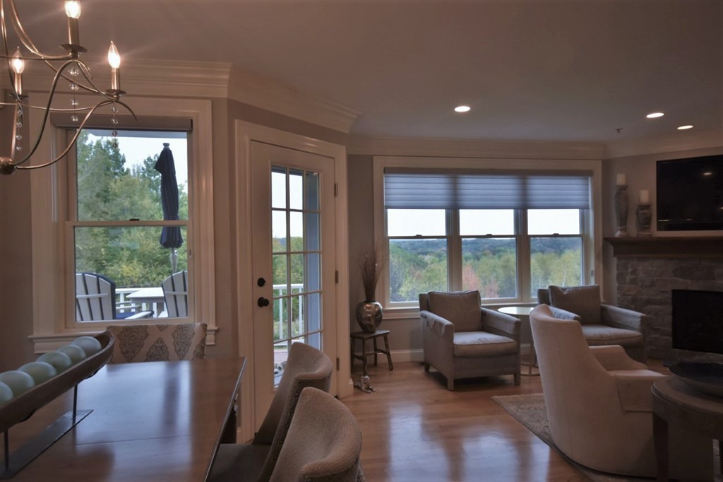 6 Atlantic View, Unit 6 Amesbury, MA 01913 - Photo 11 of 42 a living room with furniture and a floor to ceiling window