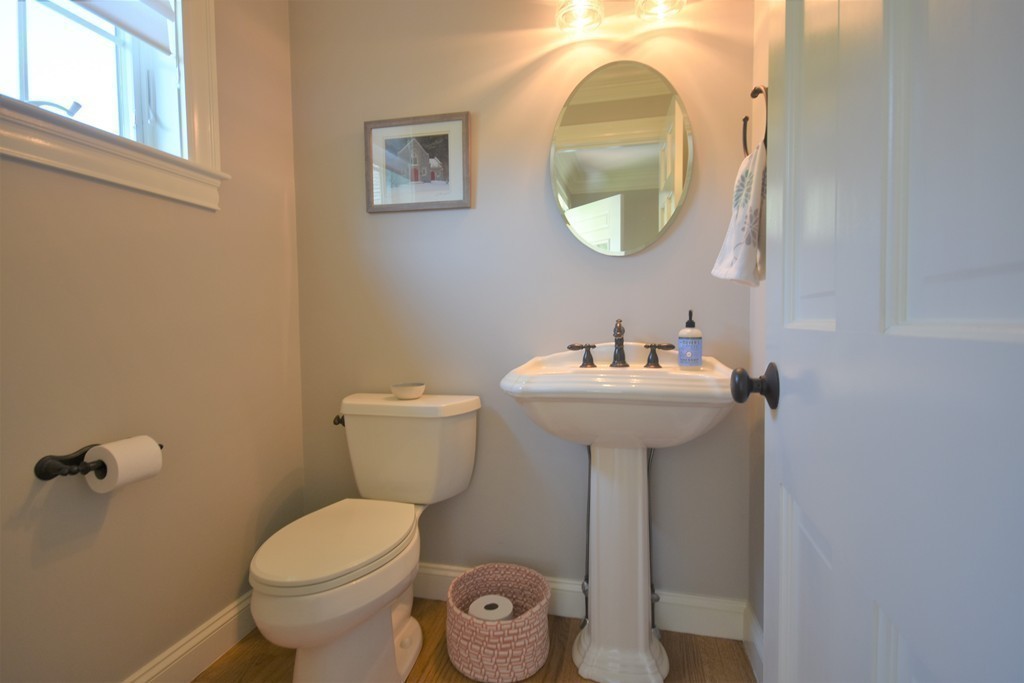 6 Atlantic View, Unit 6 Amesbury, MA 01913 - Photo 12 of 42 a bathroom with a sink toilet and mirror