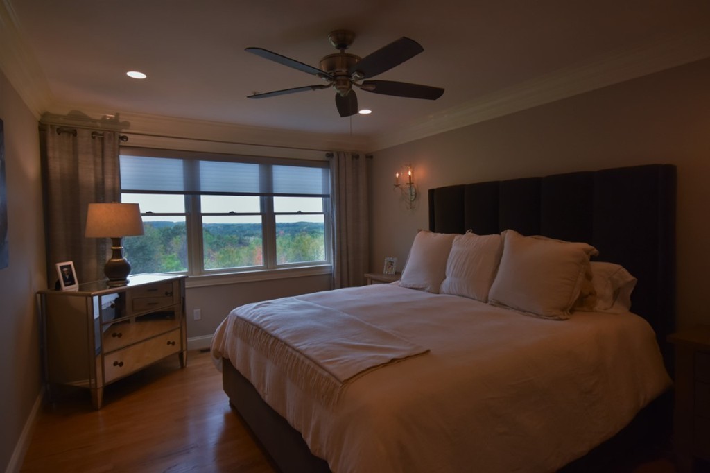 6 Atlantic View, Unit 6 Amesbury, MA 01913 - Photo 15 of 42 a bed sitting in a room next to a window