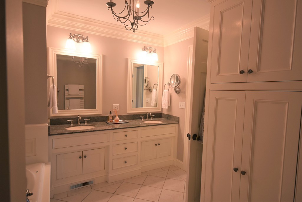 6 Atlantic View, Unit 6 Amesbury, MA 01913 - Photo 18 of 42 a bathroom with double sink and a mirror