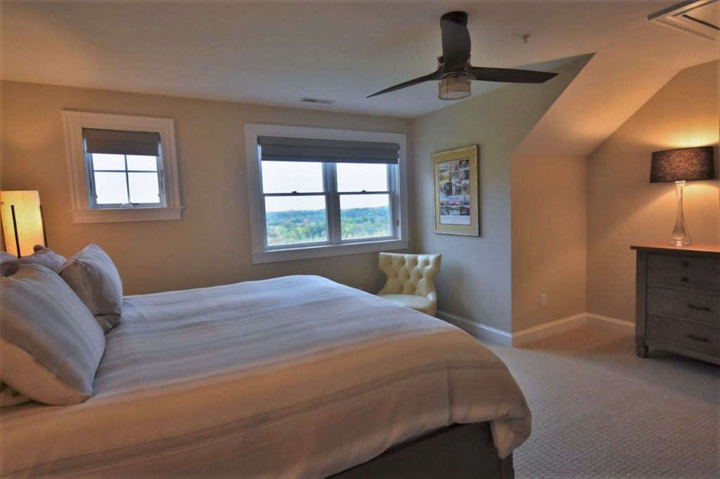 6 Atlantic View, Unit 6 Amesbury, MA 01913 - Photo 24 of 42 a bedroom with a bed and a window