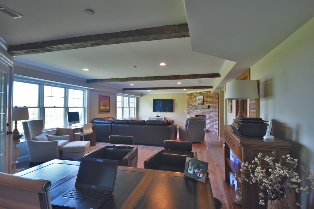 6 Atlantic View, Unit 6 Amesbury, MA 01913 - Photo 28 of 42 a living room with furniture and a flat screen tv