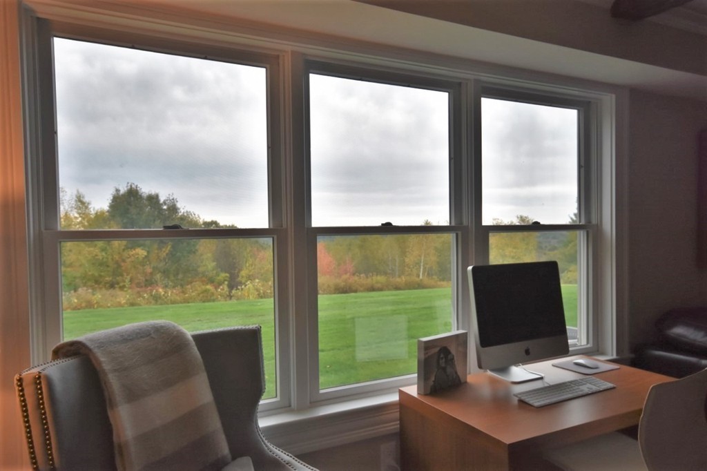 6 Atlantic View, Unit 6 Amesbury, MA 01913 - Photo 30 of 42 a laptop sitting area with furniture and floor to ceiling window