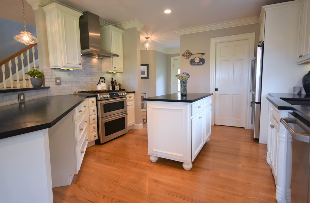 6 Atlantic View, Unit 6 Amesbury, MA 01913 - Photo 3 of 42 a kitchen with stainless steel appliances granite countertop a sink and a stove top oven