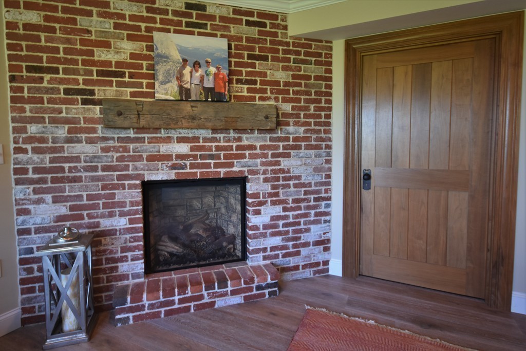 6 Atlantic View, Unit 6 Amesbury, MA 01913 - Photo 33 of 42 a living room with fireplace