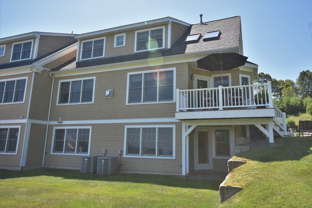 6 Atlantic View, Unit 6 Amesbury, MA 01913 - Photo 36 of 42 a front view of a house with a yard