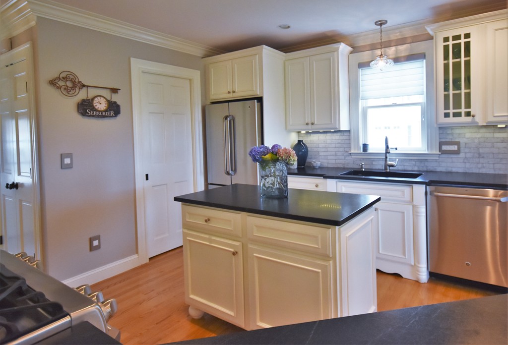 6 Atlantic View, Unit 6 Amesbury, MA 01913 - Photo 5 of 42 a kitchen with granite countertop a sink and cabinets