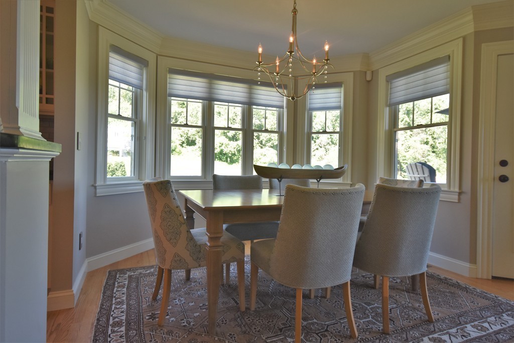 6 Atlantic View, Unit 6 Amesbury, MA 01913 - Photo 7 of 42 a dining room with furniture a chandelier and wooden floor