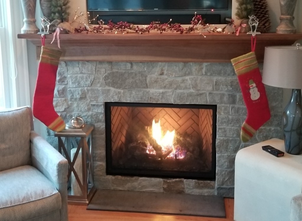 6 Atlantic View, Unit 6 Amesbury, MA 01913 - Photo 9 of 42 a living room with a fireplace and a flat screen tv