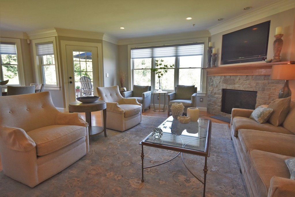 6 Atlantic View, Unit 6 Amesbury, MA 01913 - Photo 10 of 42 a living room with furniture or fireplace and a flat screen tv