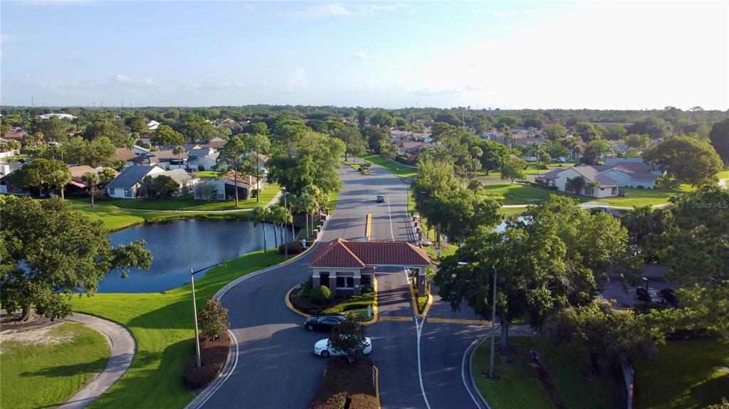 3233 Candle Ridge Drive, Unit 101 Orlando, FL 32822 - Photo 18 of 24 an aerial view of a house with garden space and lake view