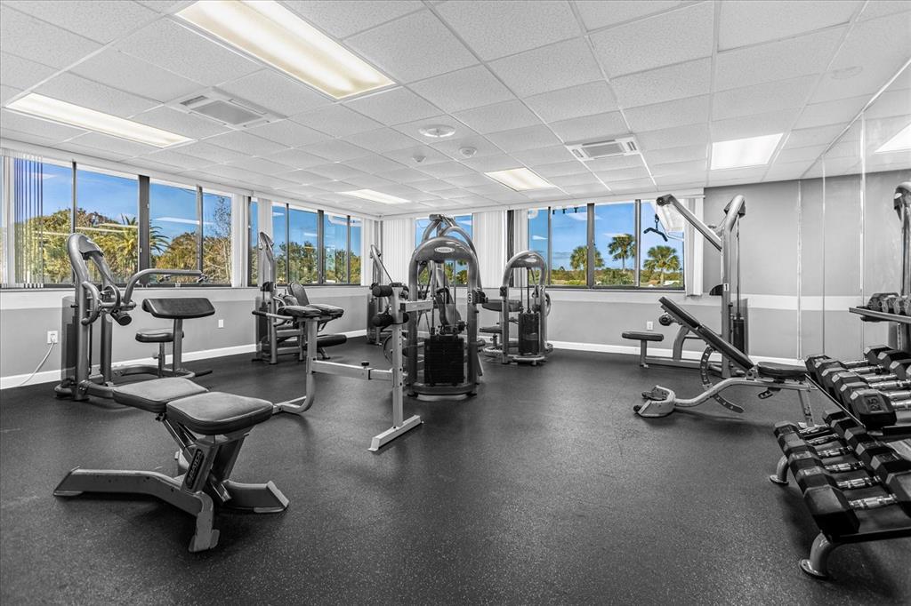 3233 Candle Ridge Drive, Unit 101 Orlando, FL 32822 - Photo 23 of 24 a view of a room with gym equipment