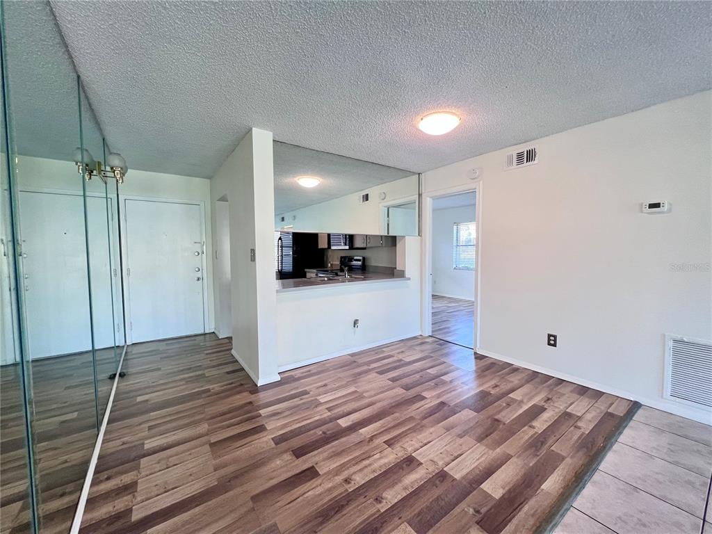 3233 Candle Ridge Drive, Unit 101 Orlando, FL 32822 - Photo 4 of 24 a view of a kitchen with a sink and a refrigerator