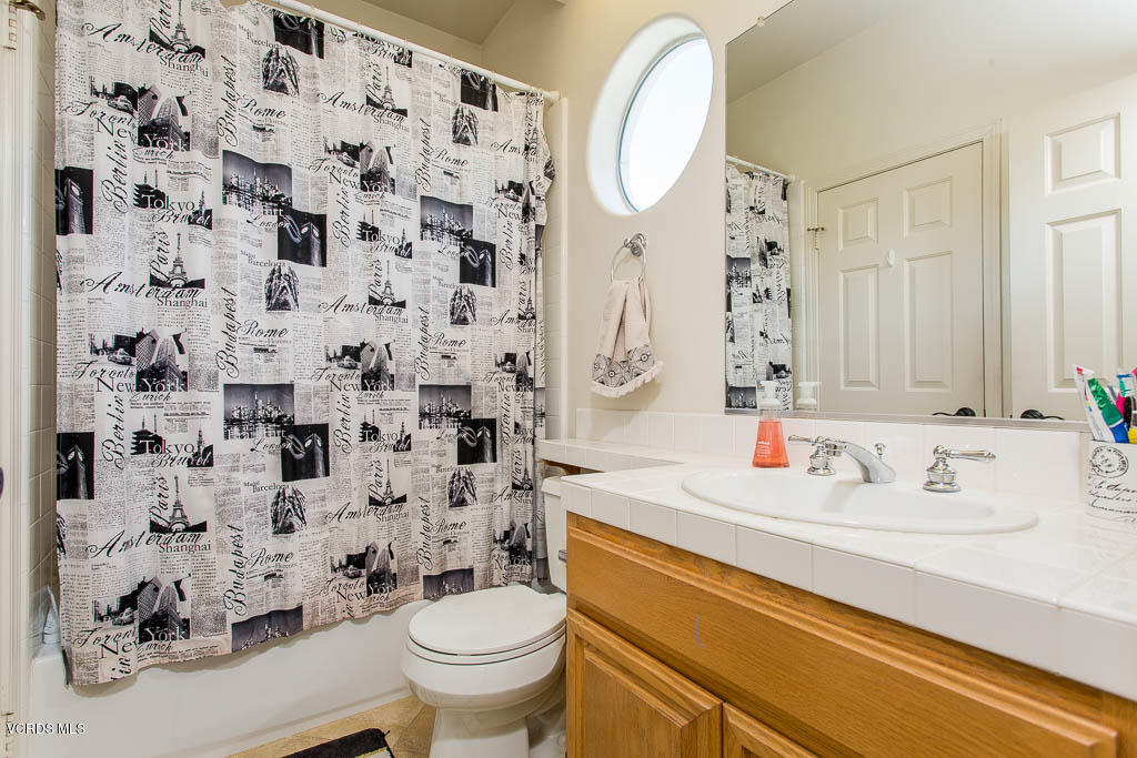 3877 Sunsetridge Road Moorpark, CA 93021 - Photo 19 of 30 a bathroom with a sink toilet and shower