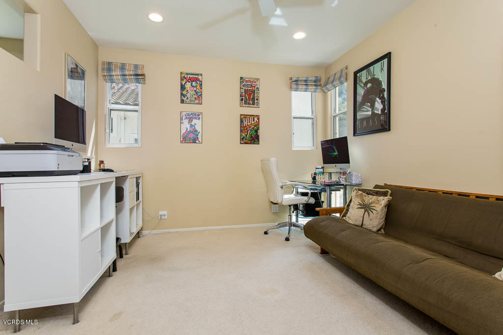 3877 Sunsetridge Road Moorpark, CA 93021 - Photo 21 of 30 a living room with furniture and a flat screen tv