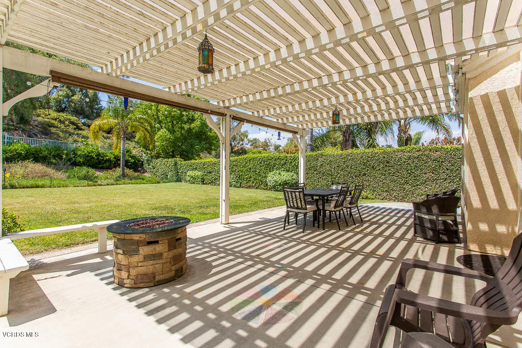 3877 Sunsetridge Road Moorpark, CA 93021 - Photo 27 of 30 a view of a patio with table and chairs and wooden floor