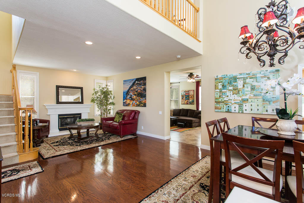 3877 Sunsetridge Road Moorpark, CA 93021 - Photo 5 of 30 a living room with fireplace furniture and a wooden floor
