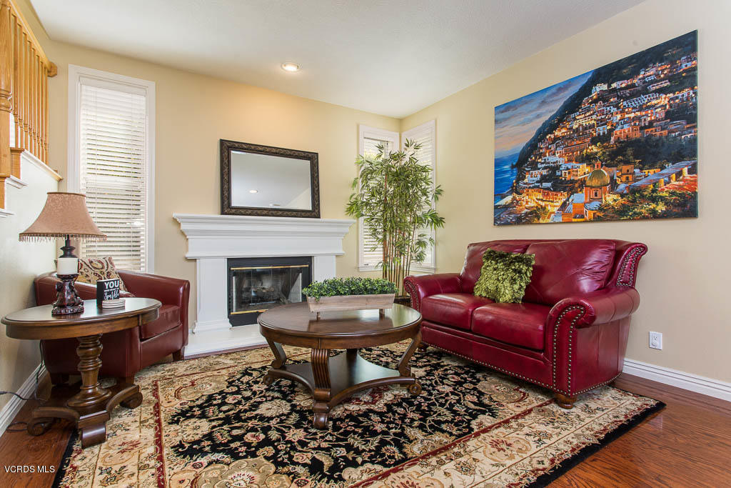 3877 Sunsetridge Road Moorpark, CA 93021 - Photo 7 of 30 a living room with furniture and a fireplace