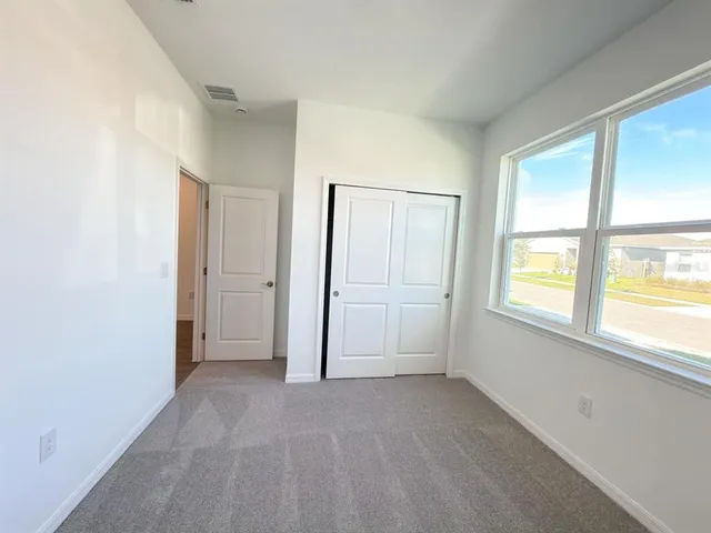 a bathroom with a double vanity sink mirror and toilet