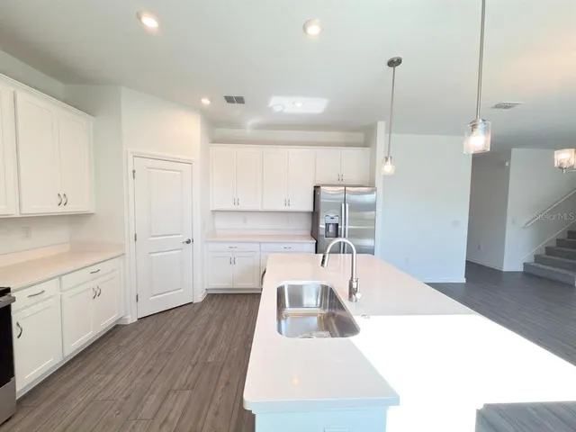 a bathroom with a sink a toilet a bathtub and shower