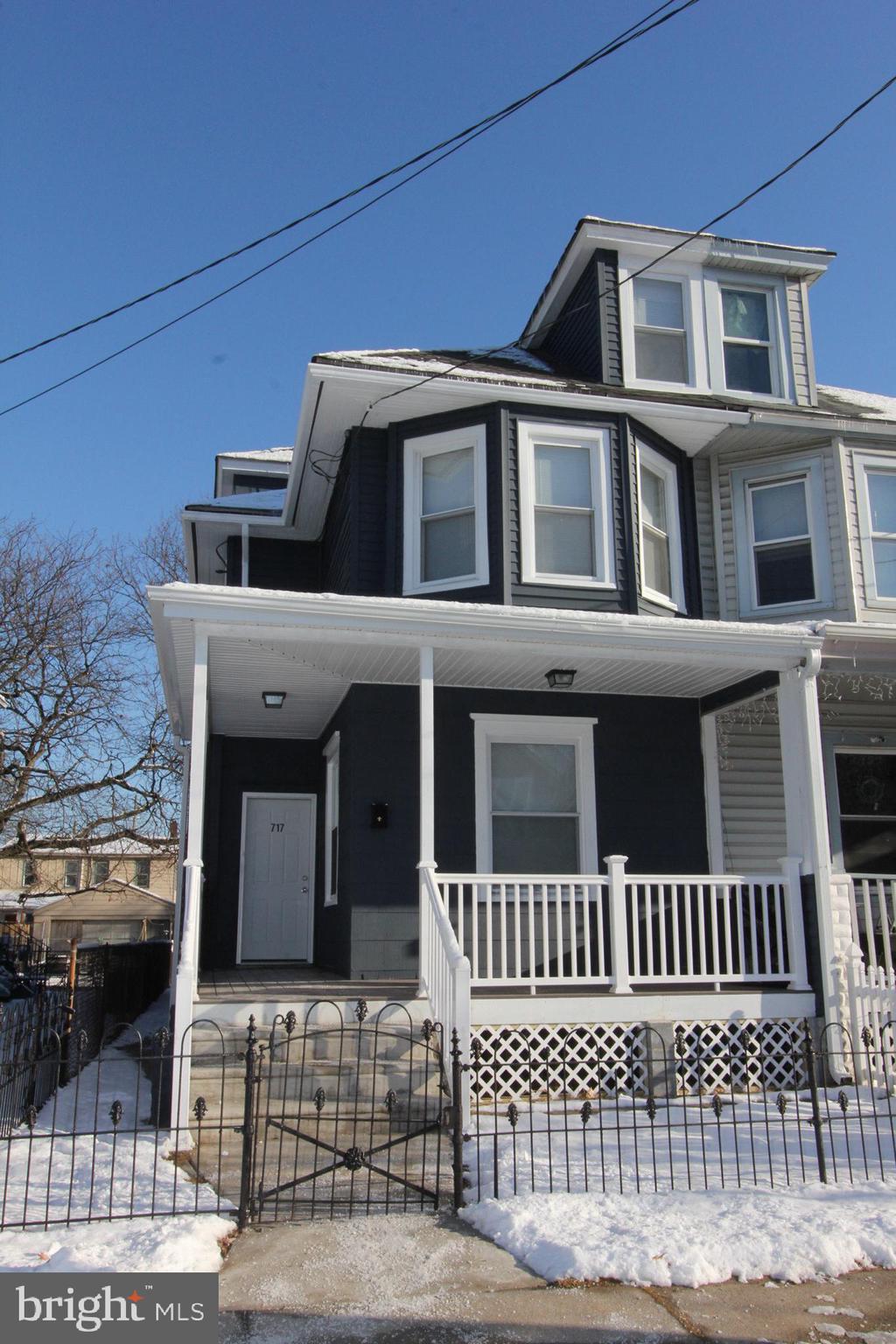 717 Hunter Street Gloucester City, NJ 08030 - Photo 3 of 31 a view of a brick house with large windows