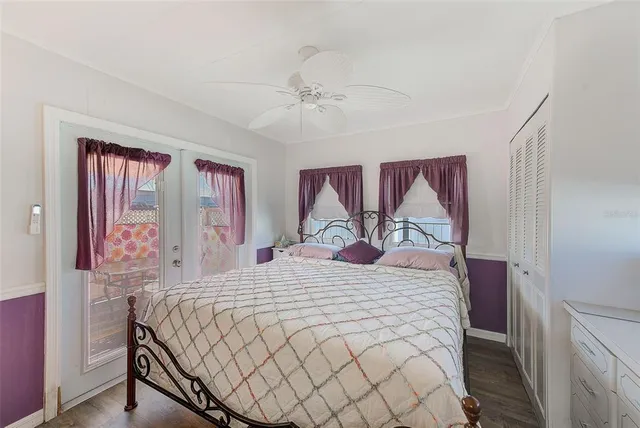 a bedroom with a large bed and a large window