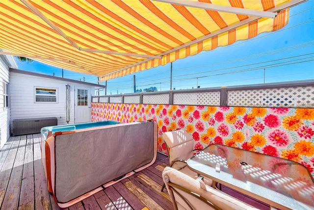 a view of a house with swimming pool and a porch