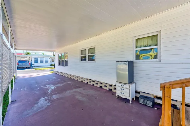 a view of balcony with wooden floor
