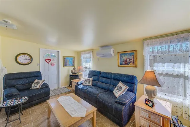 a living room with furniture and a couch