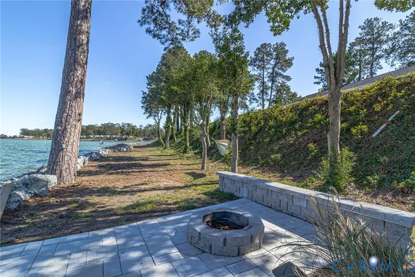 a view of a backyard with sitting area