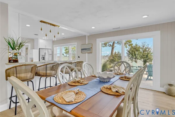 a dinning area with furniture and view of kitchen