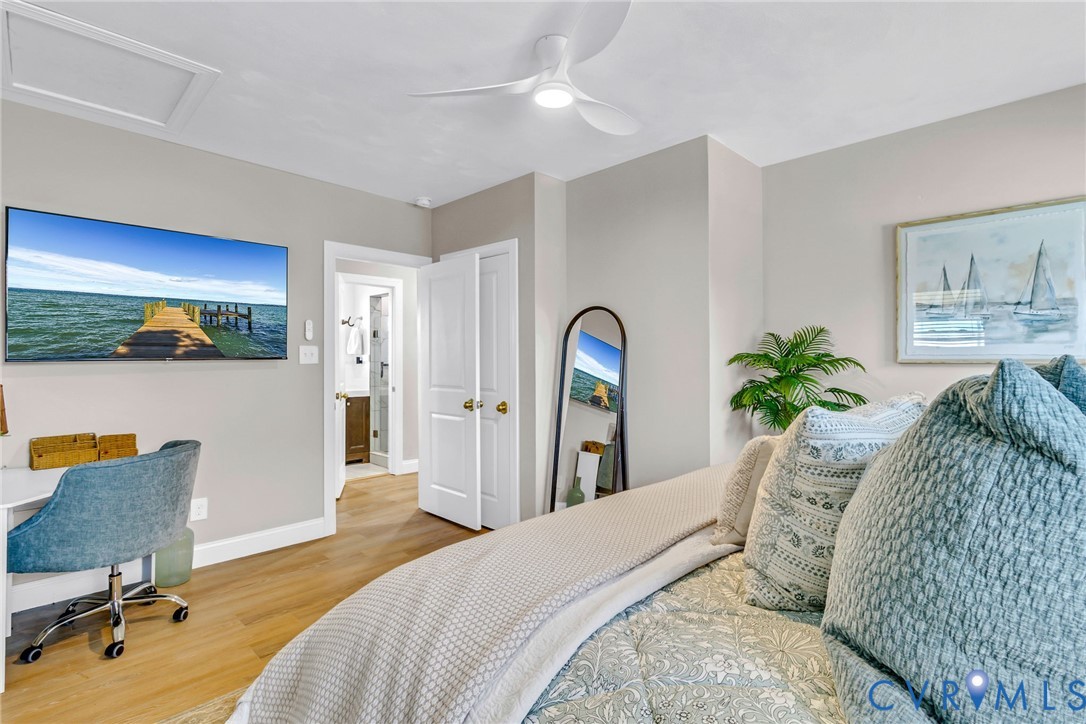 560 Eubank Landing Road Topping, VA 23169 - Photo 31 of 50 a bedroom with a bed and a couch