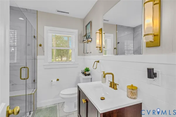 a bathroom with a sink toilet and vanity