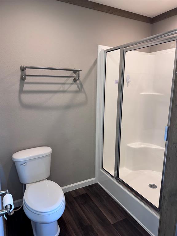 7268 Brangus Road Anna, TX 75409 - Photo 18 of 21 Walk-in shower featuring a sliding glass door and integrated seating